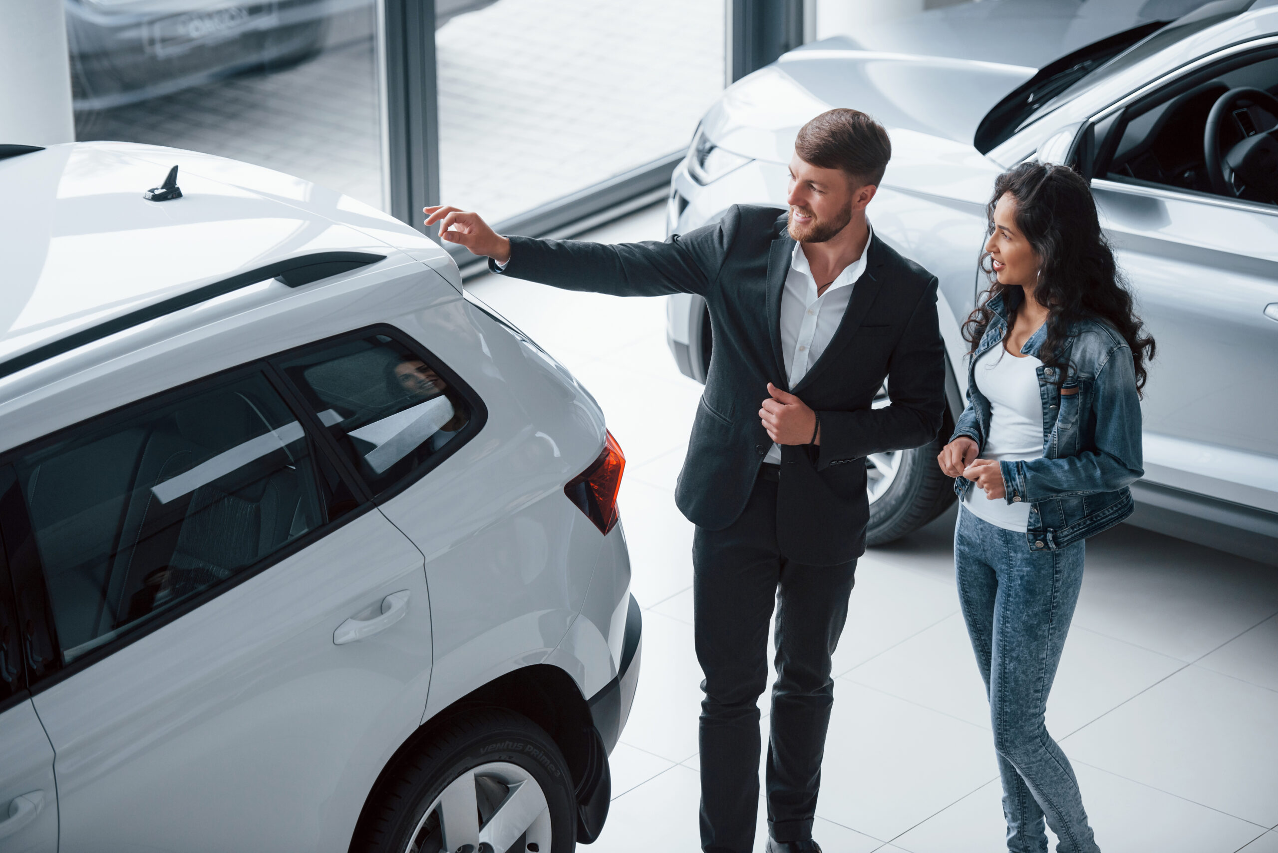 Customer in a dealerships with the salesman